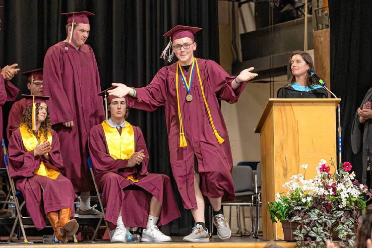 WLC senior Cameron Pixley hypes up the crowd as he walks to recieve his diploma.