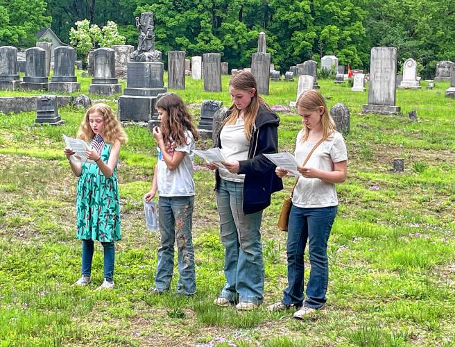 From left, Francesca Fulton, Ava Henshaw, Abigail Hedderly and Hannah Hedderly of Francestown 4-H Club recite “In Flanders Fields” by John McCrae. 