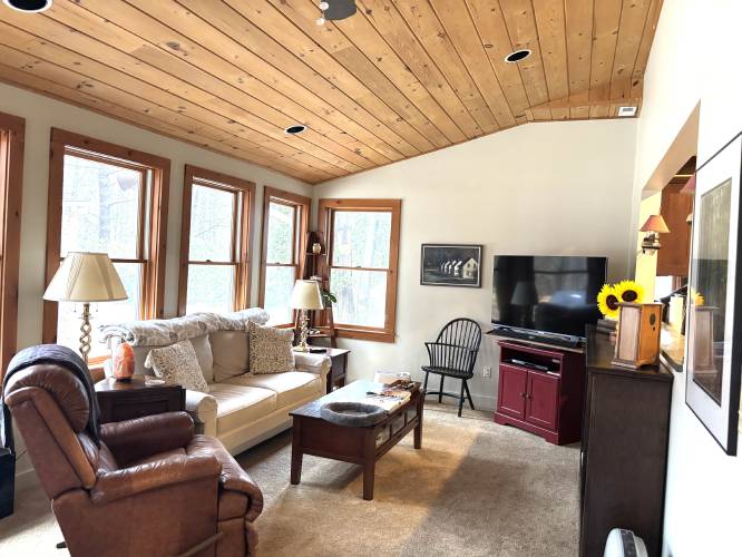 A previous owner added the enclosed sunroom/family room to The Lodge.