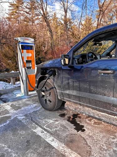A Ford charging at one of the new EV charging stations at Alltown Peterborough on Grove Street.